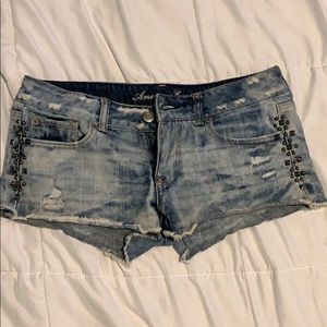 Low rise acid wash denim shorts with beading